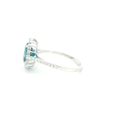 18K white gold London Blue Topaz halo ring featuring a 2.04 Carat round natural topaz surrounded by a sparkling natural diamond halo.
