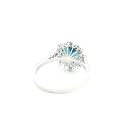 18K white gold London Blue Topaz halo ring featuring a 2.04 Carat round natural topaz surrounded by a sparkling natural diamond halo.