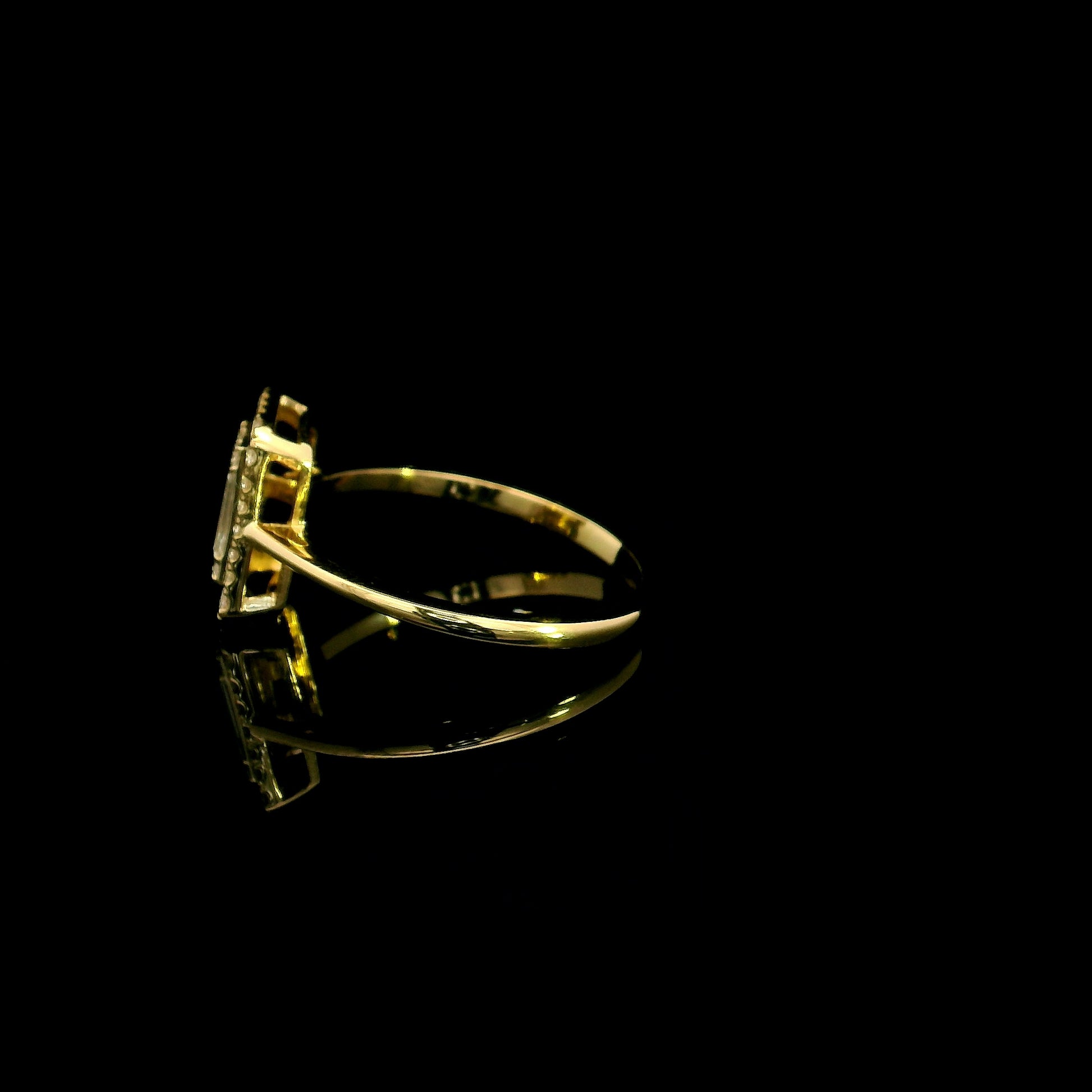 18K yellow gold rectangular halo diamond ring featuring baguette and round natural diamonds with a total diamond weight of 0.37 carats.