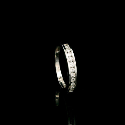 18K white gold channel set diamond wedding band featuring 0.36 carat natural round brilliant diamonds in a sleek polished stackable ring design.