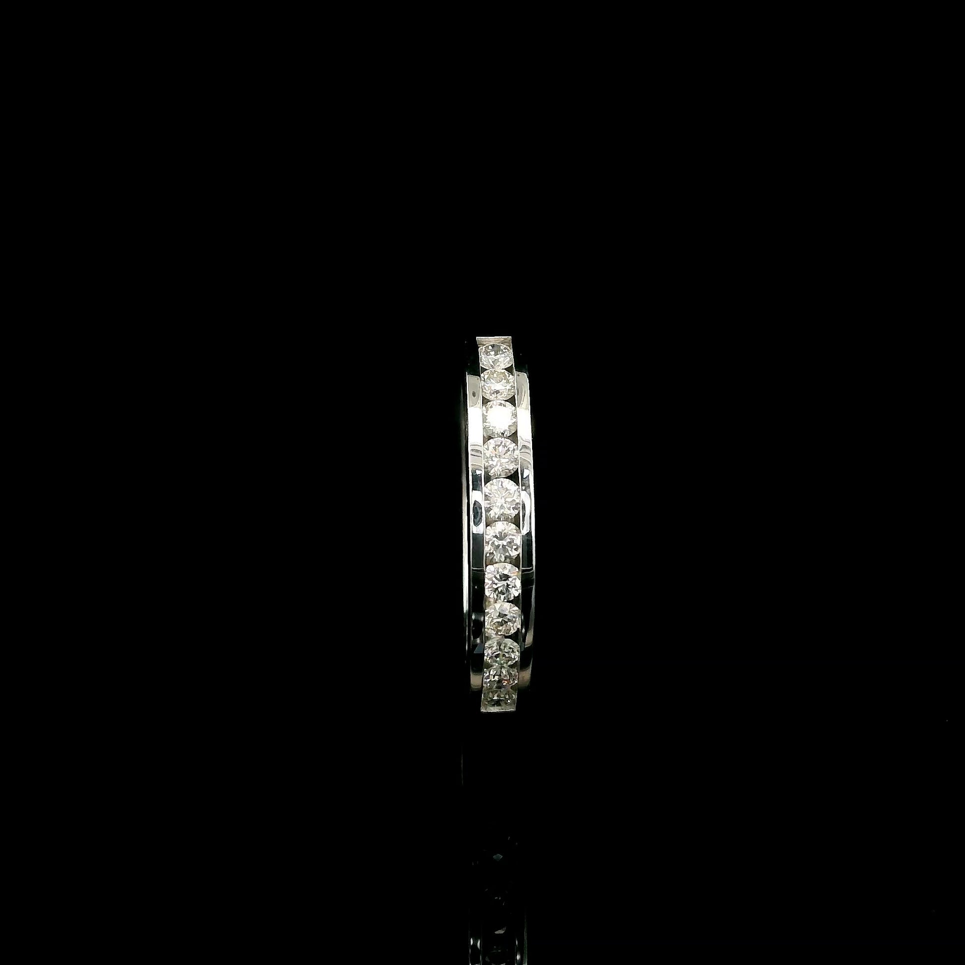 18K white gold channel set diamond wedding band featuring 0.36 carat natural round brilliant diamonds in a sleek polished stackable ring design.