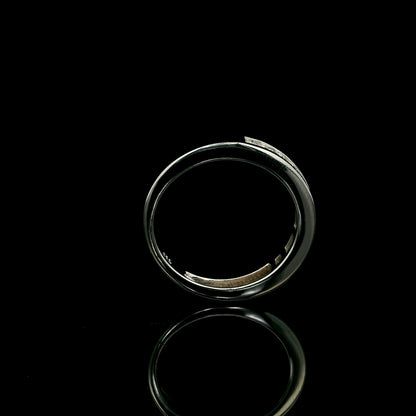 18K white gold channel set diamond wedding band featuring 0.36 carat natural round brilliant diamonds in a sleek polished stackable ring design.