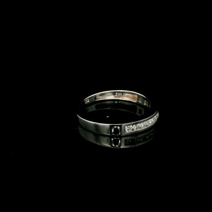 18K white gold channel set diamond wedding band featuring 0.36 carat natural round brilliant diamonds in a sleek polished stackable ring design.