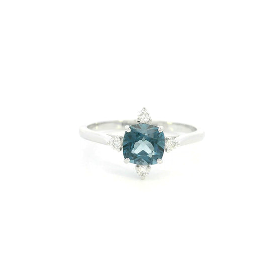 18K white gold London Blue Topaz ring featuring a 1.10 carat natural cushion-cut London Blue Topaz with 0.14 carat natural diamond accents.