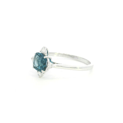 18K white gold London Blue Topaz ring featuring a 1.10 carat natural cushion-cut London Blue Topaz with 0.14 carat natural diamond accents.