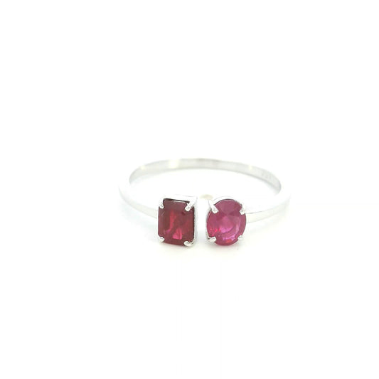 18K White Gold Natural Ruby Toi et Moi Ring featuring an oval and emerald-cut ruby in a modern open design.