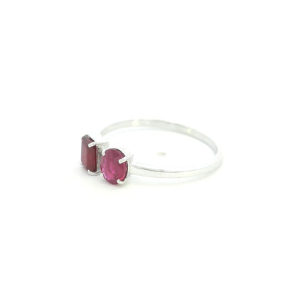 18K White Gold Natural Ruby Toi et Moi Ring featuring an oval and emerald-cut ruby in a modern open design.