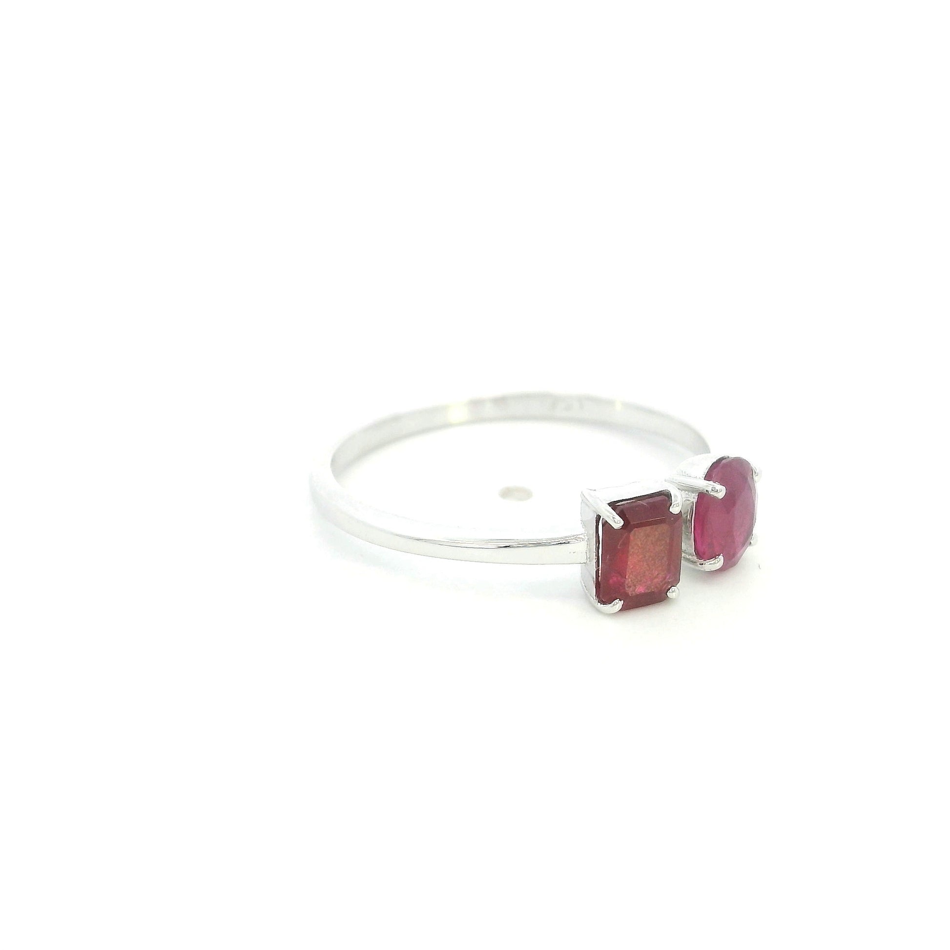 18K White Gold Natural Ruby Toi et Moi Ring featuring an oval and emerald-cut ruby in a modern open design.