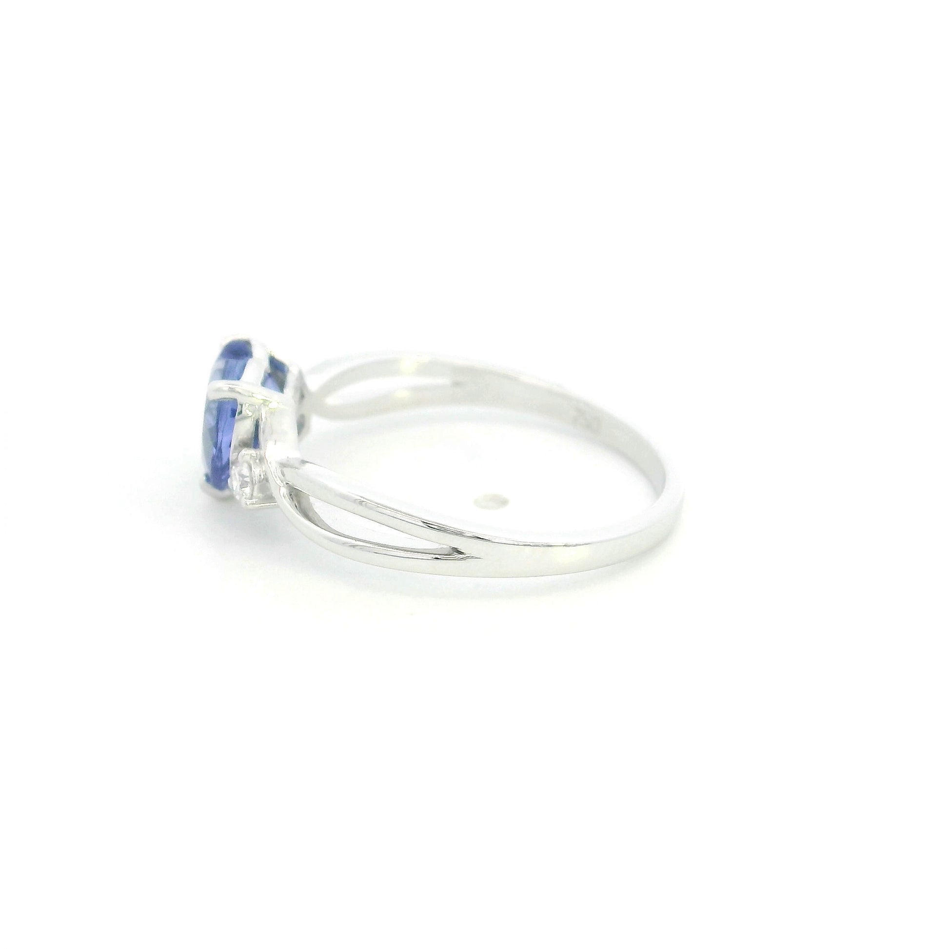 18K white gold heart tanzanite ring featuring a 1.29 carat heart-shaped natural tanzanite with 0.09 carat natural diamond accents.