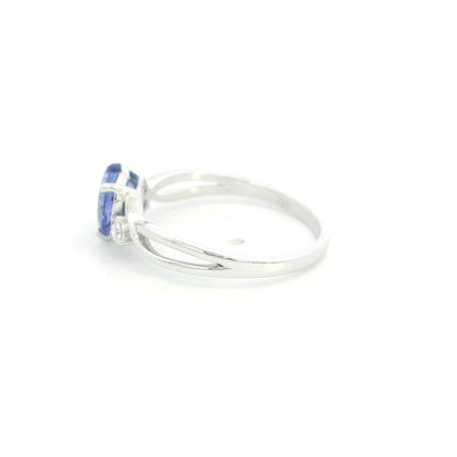 18K white gold heart tanzanite ring featuring a 1.29 carat heart-shaped natural tanzanite with 0.09 carat natural diamond accents.