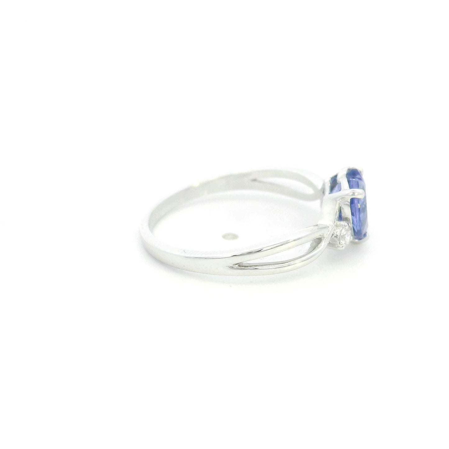 18K white gold heart tanzanite ring featuring a 1.29 carat heart-shaped natural tanzanite with 0.09 carat natural diamond accents.