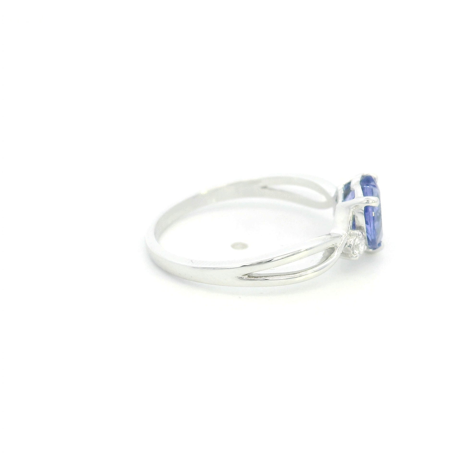 18K white gold heart tanzanite ring featuring a 1.29 carat heart-shaped natural tanzanite with 0.09 carat natural diamond accents.