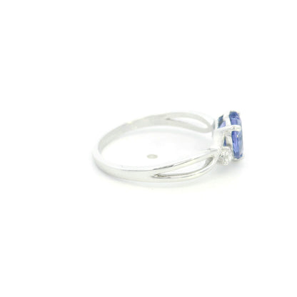 18K white gold heart tanzanite ring featuring a 1.29 carat heart-shaped natural tanzanite with 0.09 carat natural diamond accents.