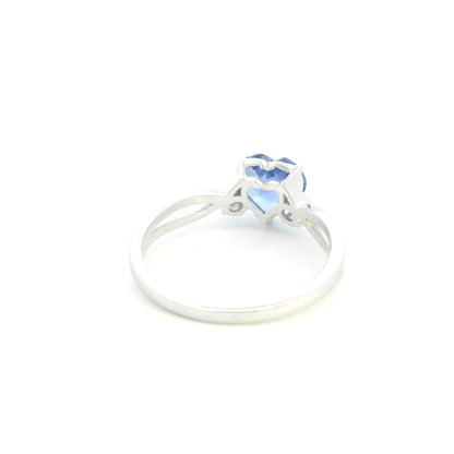 18K white gold heart tanzanite ring featuring a 1.29 carat heart-shaped natural tanzanite with 0.09 carat natural diamond accents.
