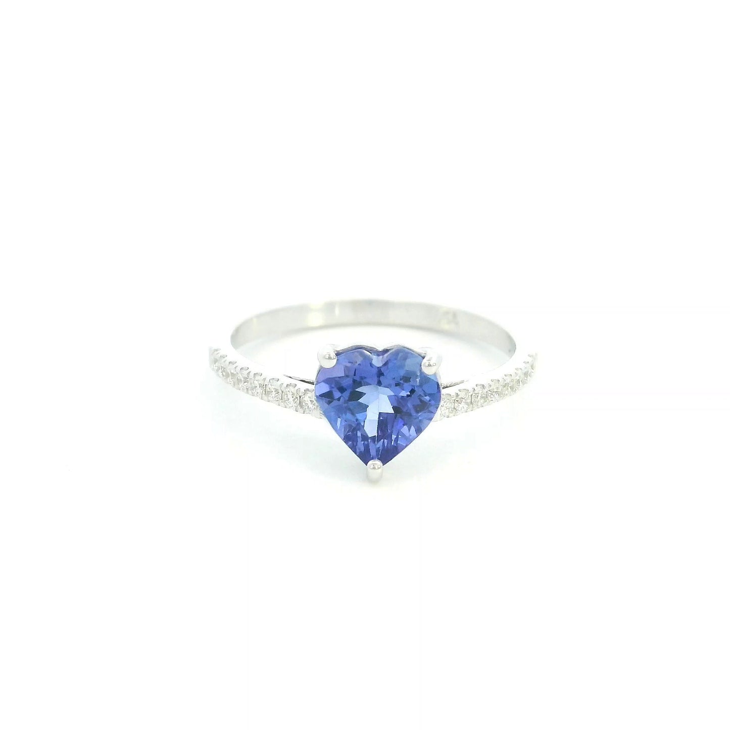 Heart Tanzanite Diamond Ring in 18K white gold featuring a natural 1.08 carat heart-cut tanzanite with a diamond-set band.