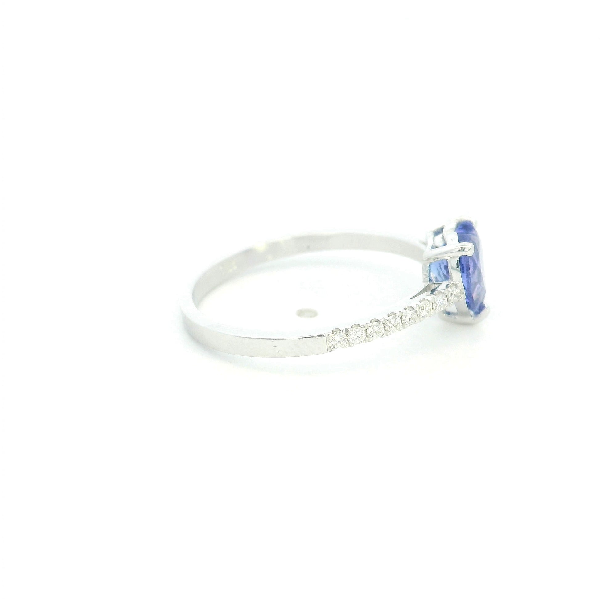 Heart Tanzanite Diamond Ring in 18K white gold featuring a natural 1.08 carat heart-cut tanzanite with a diamond-set band.