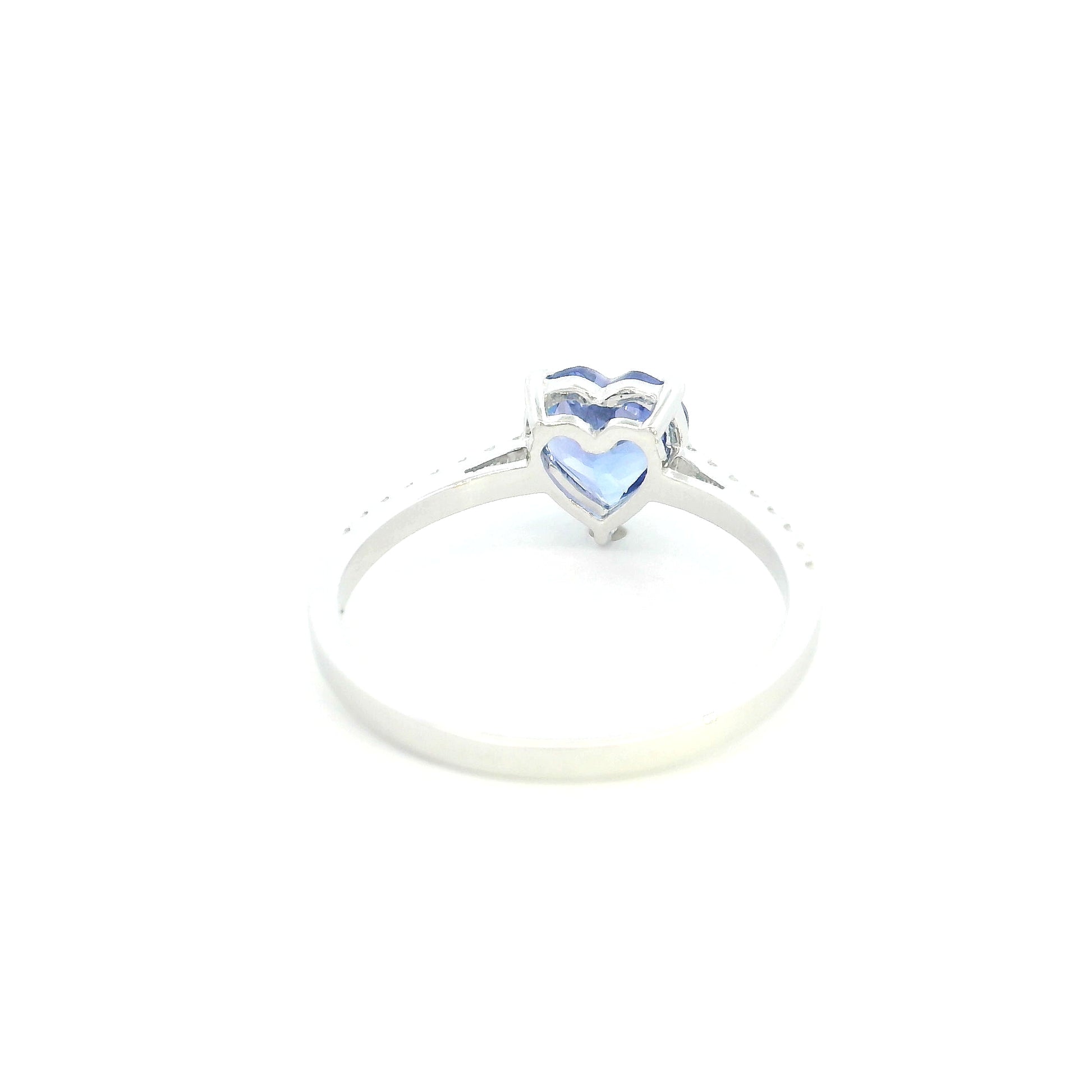 Heart Tanzanite Diamond Ring in 18K white gold featuring a natural 1.08 carat heart-cut tanzanite with a diamond-set band.