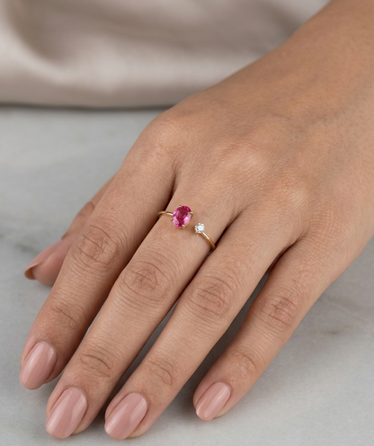 18K yellow gold open ruby and diamond ring with a 0.50 carat oval ruby and natural round diamond