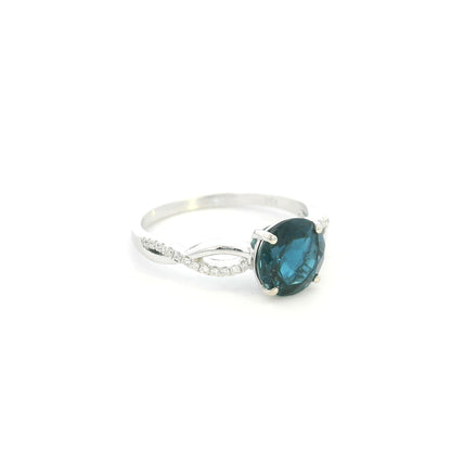 London Blue Topaz diamond ring in 18K white gold with round blue topaz and diamond accented sculpted band