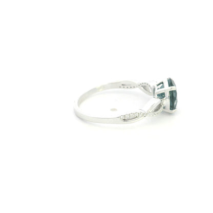 London Blue Topaz diamond ring in 18K white gold with round blue topaz and diamond accented sculpted band