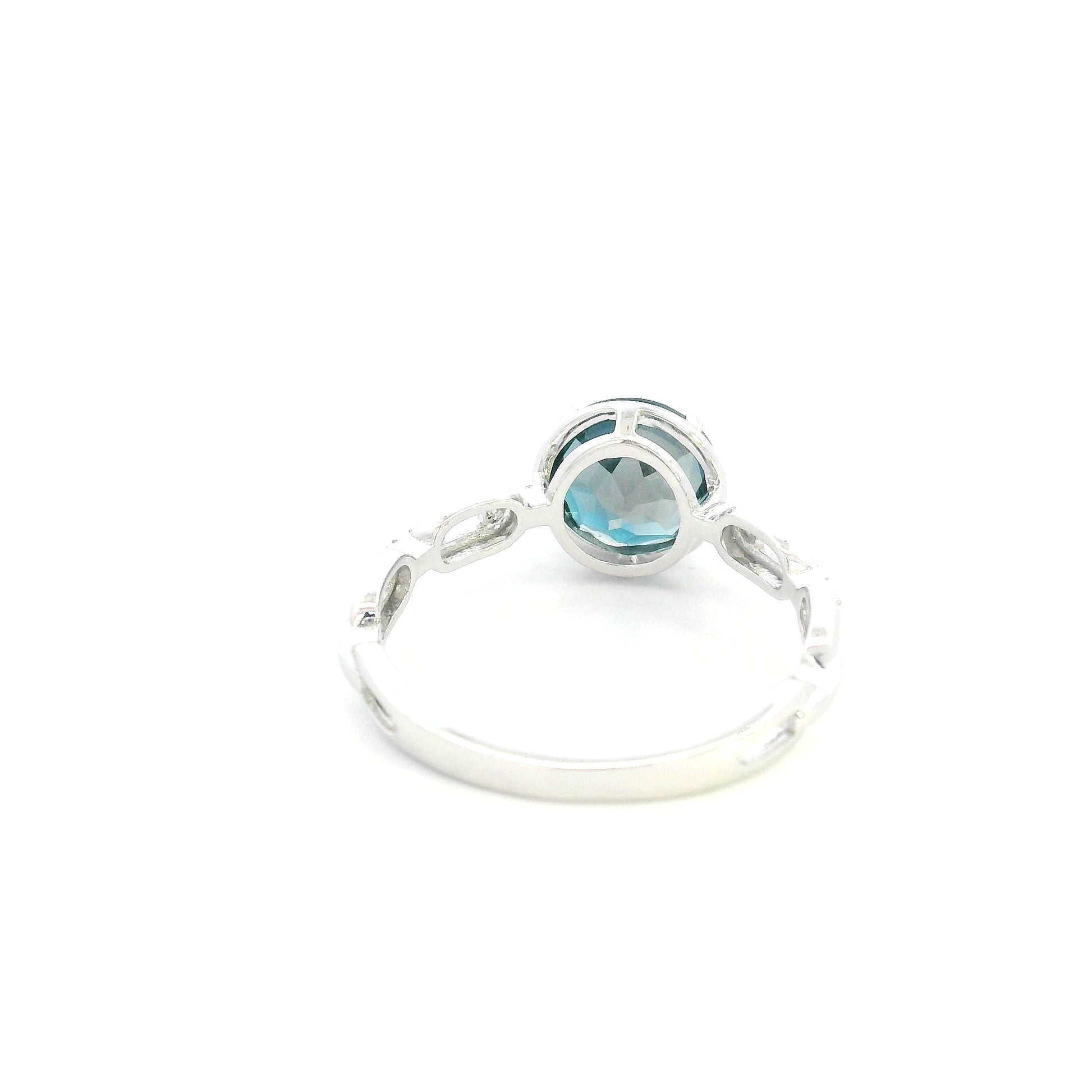 Round London Blue Topaz diamond ring in 18K white gold with sculpted open-detail band