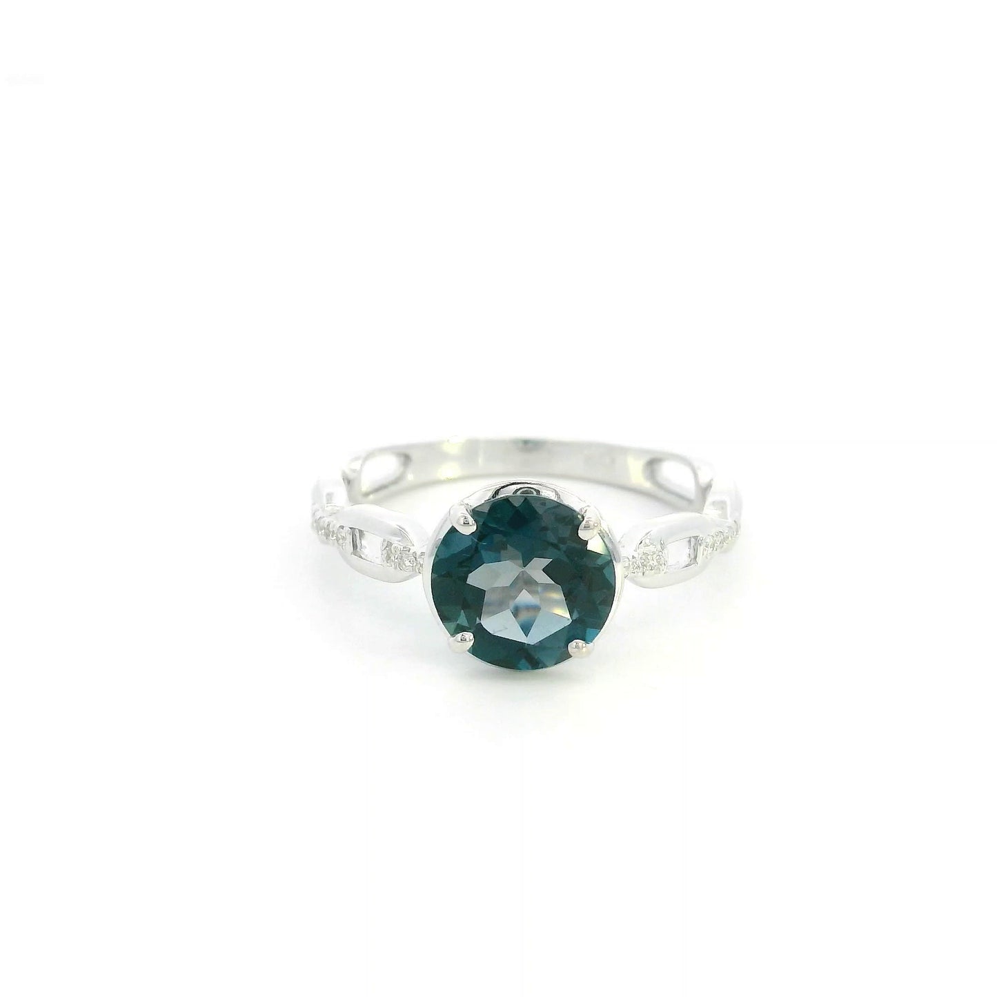 Round London Blue Topaz diamond ring in 18K white gold with sculpted open-detail band