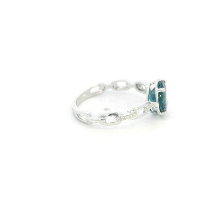 Round London Blue Topaz diamond ring in 18K white gold with sculpted open-detail band