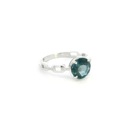 Round London Blue Topaz diamond ring in 18K white gold with sculpted open-detail band