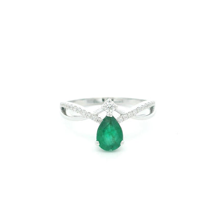 Pear shaped natural emerald and diamond ring in 18K white gold with diamond accented sculpted shoulders