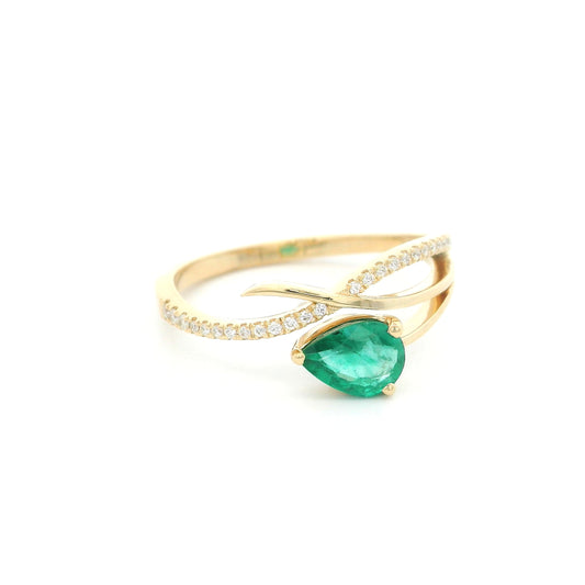 18K yellow gold emerald crossover ring featuring a 0.51 carat natural emerald and 0.09 carat natural diamond accent band.