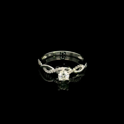 18K White Gold Diamond Engagement Ring with a 0.31 Carat Round Brilliant Diamond and 0.11 Carat Pavé Diamond Twisted Band.
