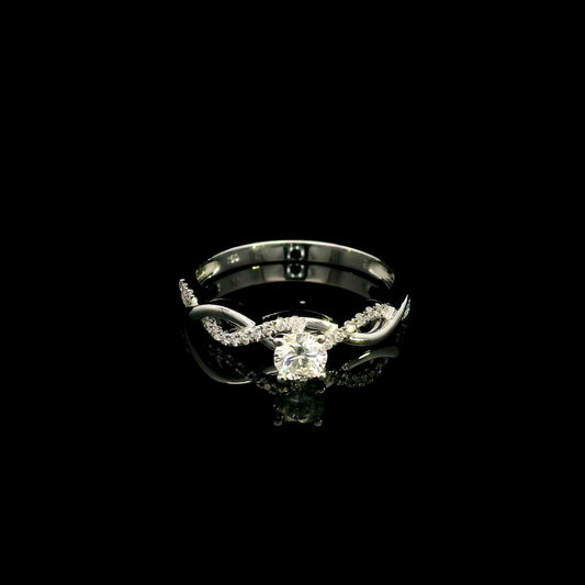 18K White Gold Diamond Engagement Ring with a 0.31 Carat Round Brilliant Diamond and 0.11 Carat Pavé Diamond Twisted Band.
