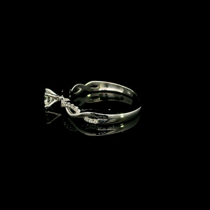 18K White Gold Diamond Engagement Ring with a 0.31 Carat Round Brilliant Diamond and 0.11 Carat Pavé Diamond Twisted Band.
