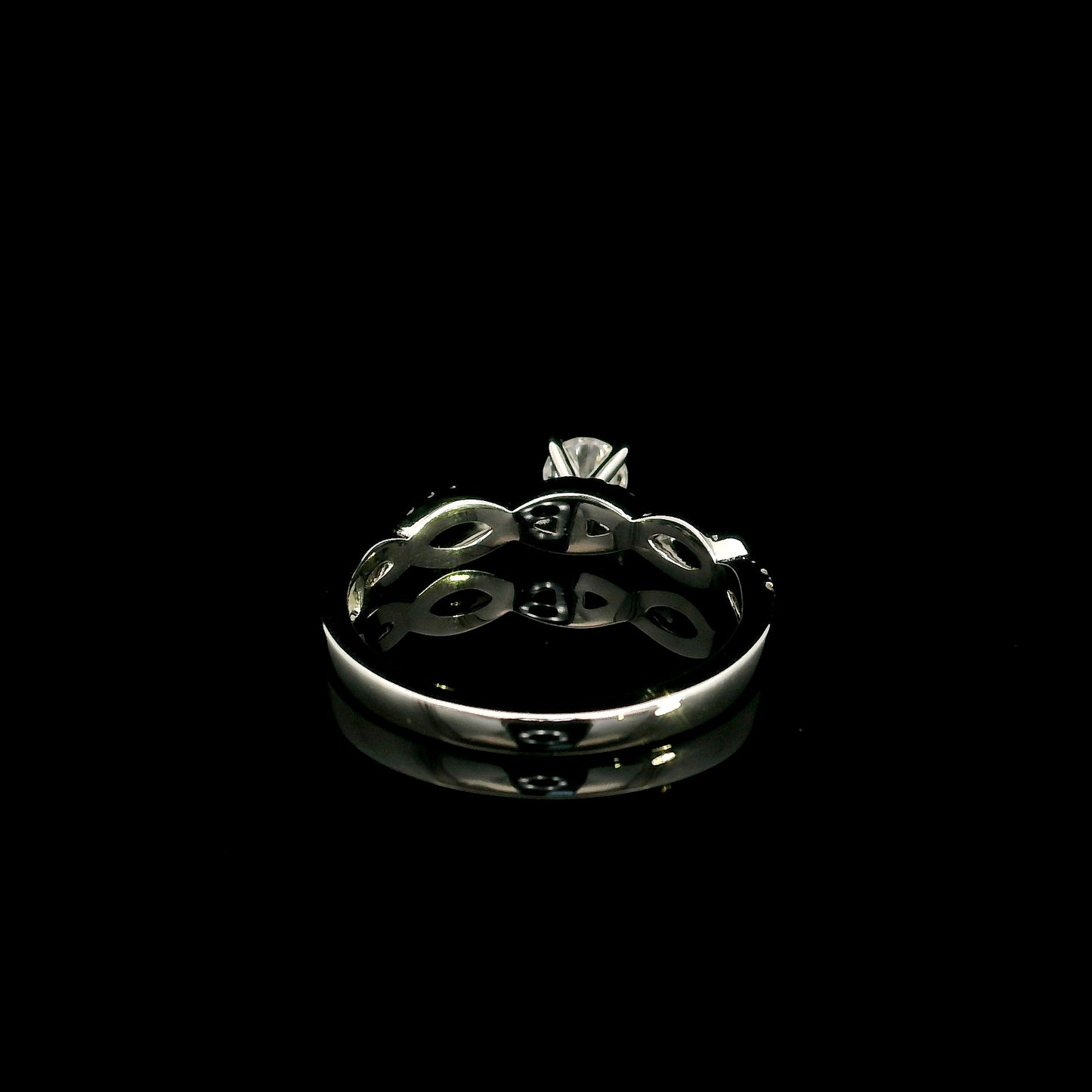18K White Gold Diamond Engagement Ring with a 0.31 Carat Round Brilliant Diamond and 0.11 Carat Pavé Diamond Twisted Band.