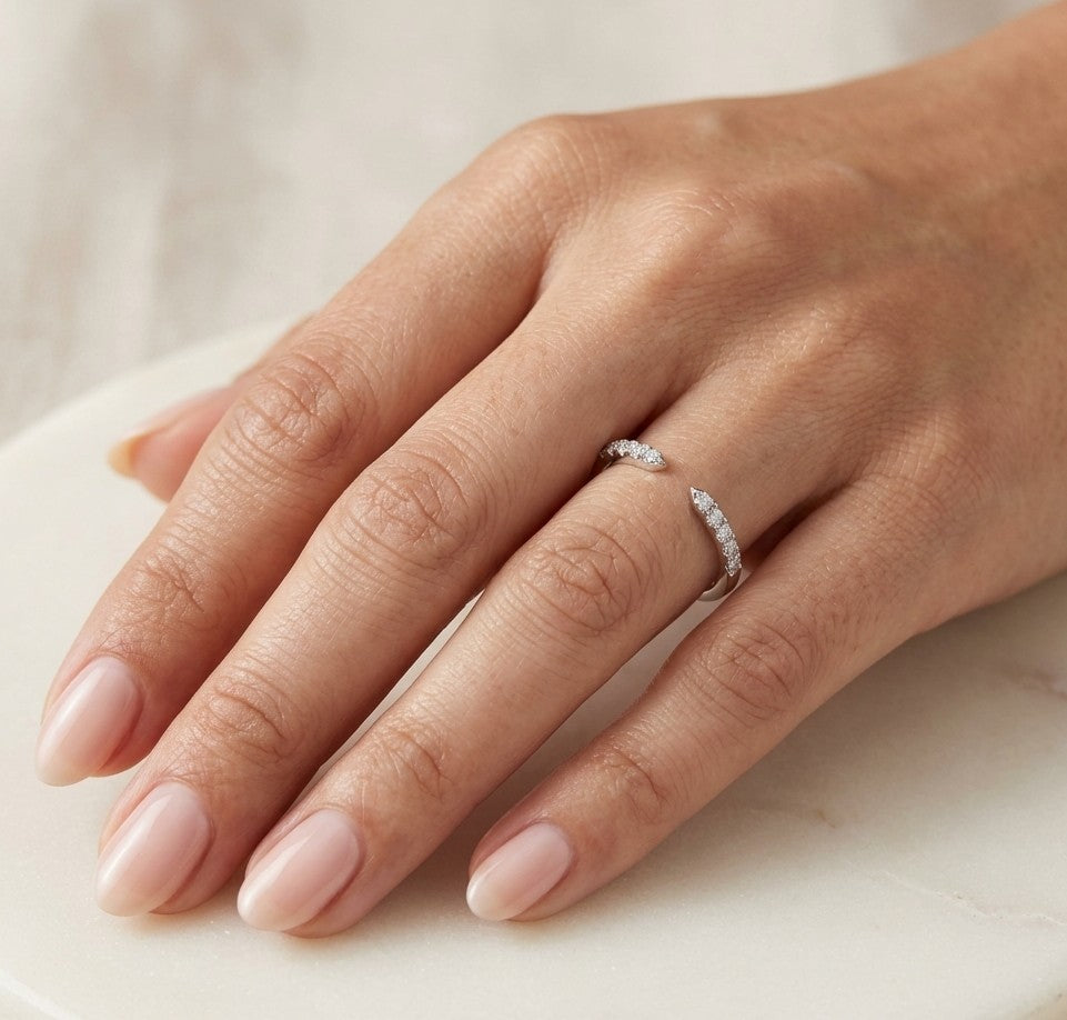 18K white gold open diamond contour ring with curved diamond-set ends, suitable as a stacking ring or wedding band