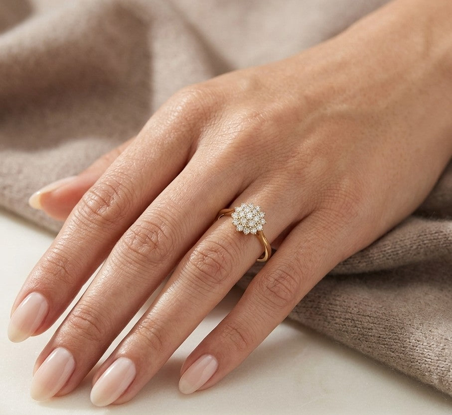 Diamond cluster ring in 18K yellow gold featuring 0.35 carat of round natural diamonds in a floral-inspired arrangement