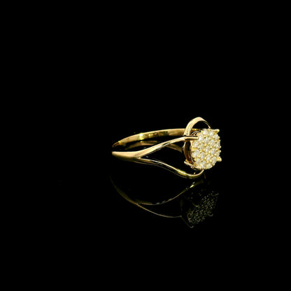 18K yellow gold diamond cluster ring with round diamonds and flowing sculptural swirl design by Emirates Diamonds.