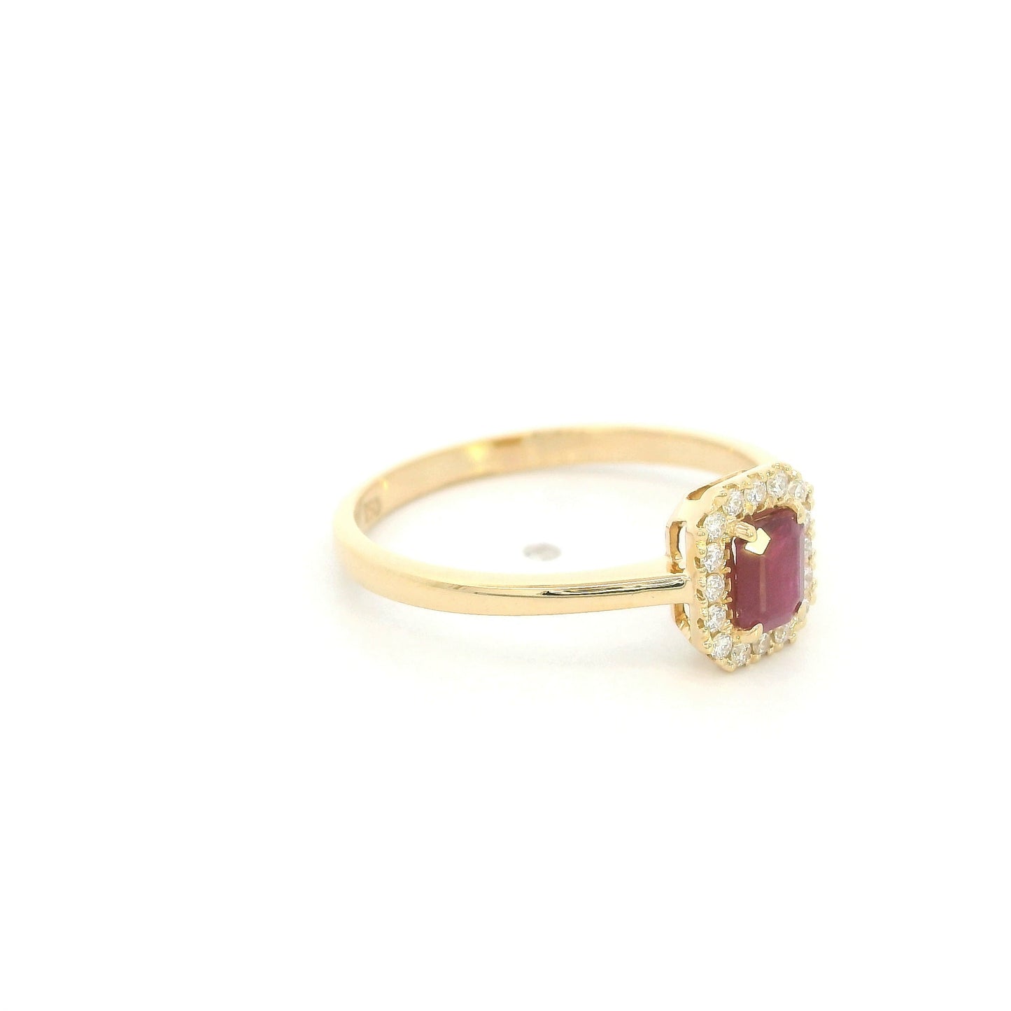 Ruby and diamond halo ring in 18K yellow gold with rectangular red ruby, round diamond surround and polished gold band.