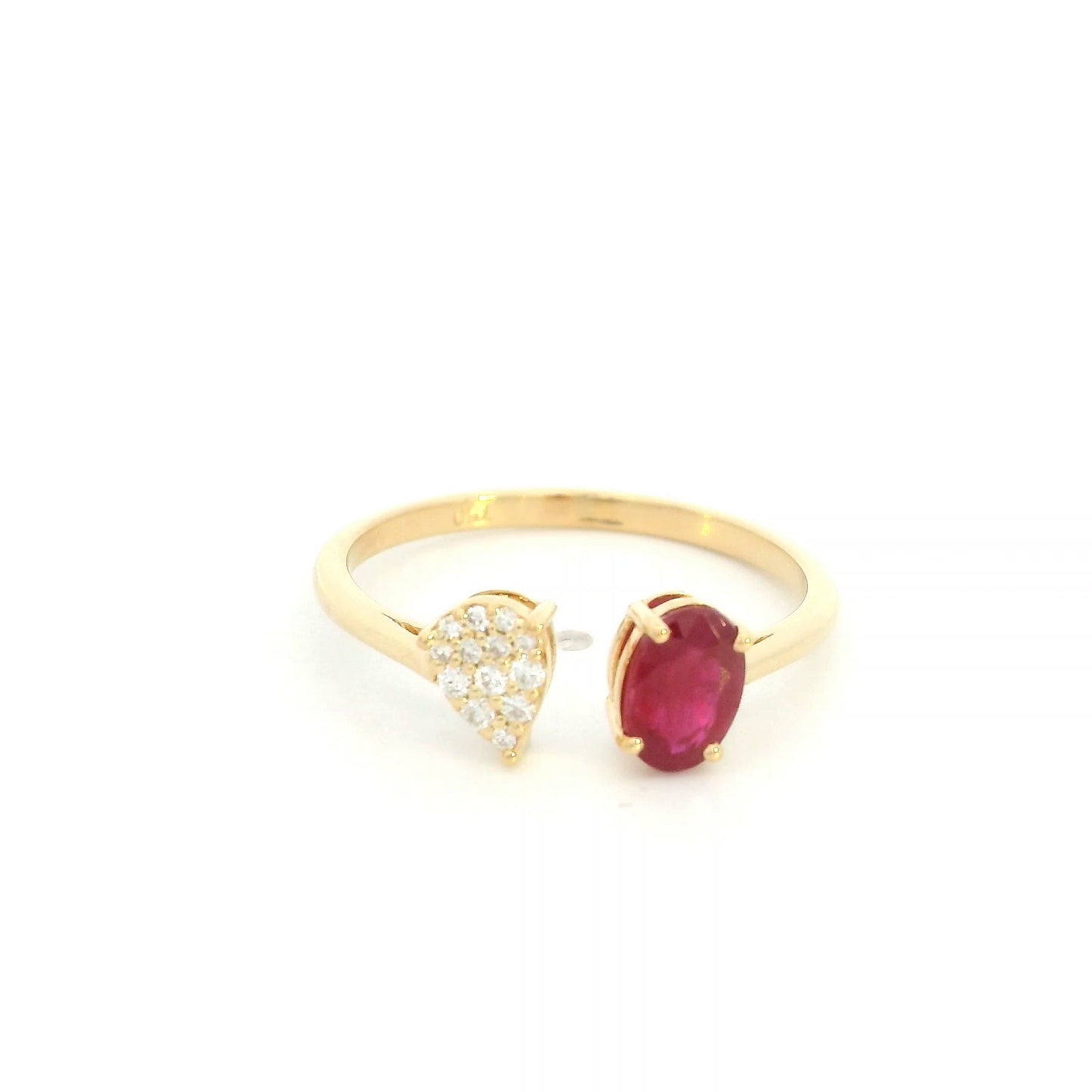 Oval ruby and diamond open ring in 18K yellow gold with pear shaped diamond cluster