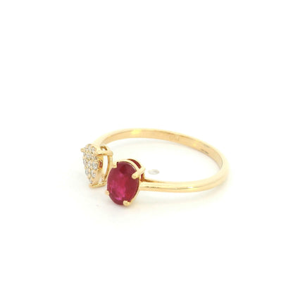 Oval ruby and diamond open ring in 18K yellow gold with pear shaped diamond cluster