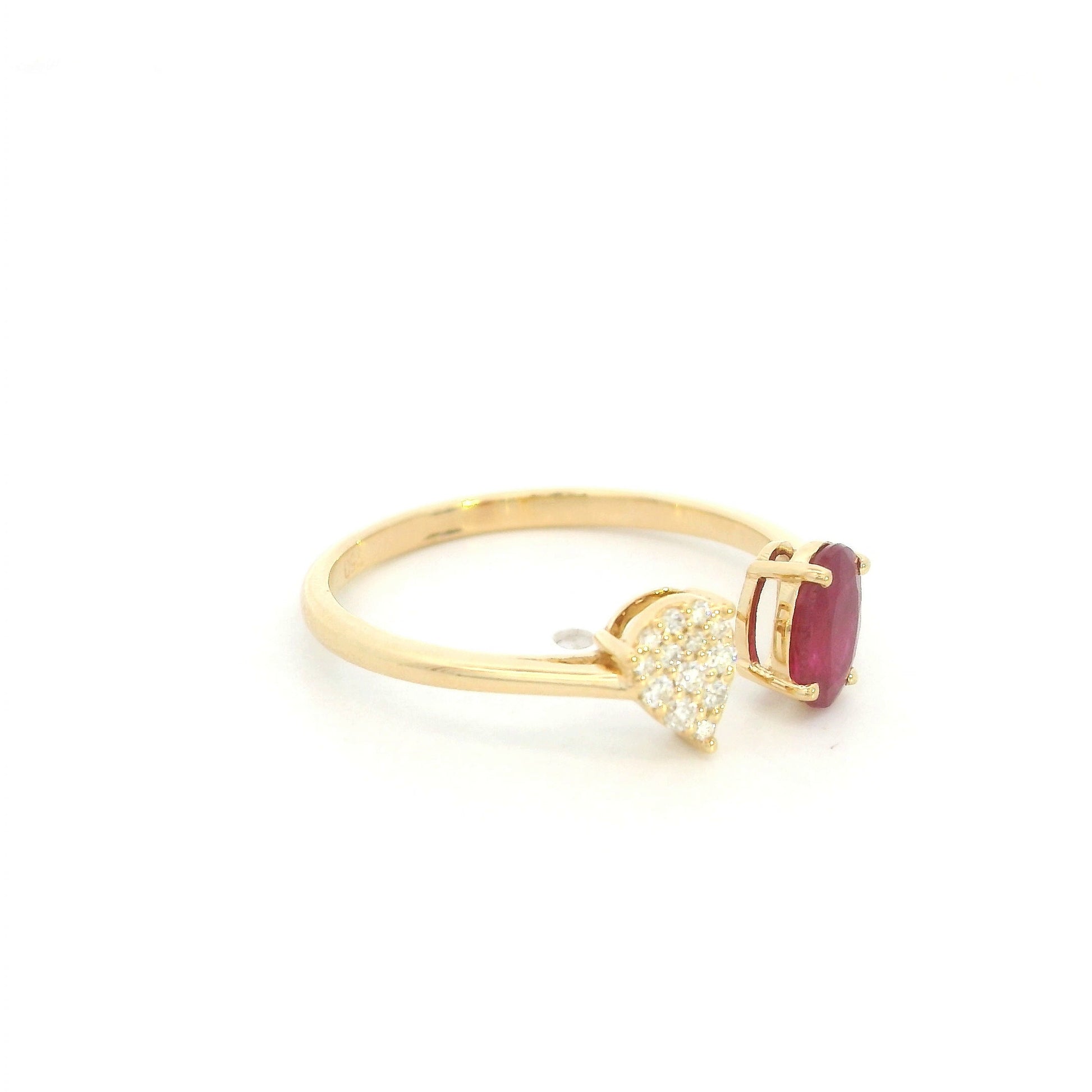 Oval ruby and diamond open ring in 18K yellow gold with pear shaped diamond cluster