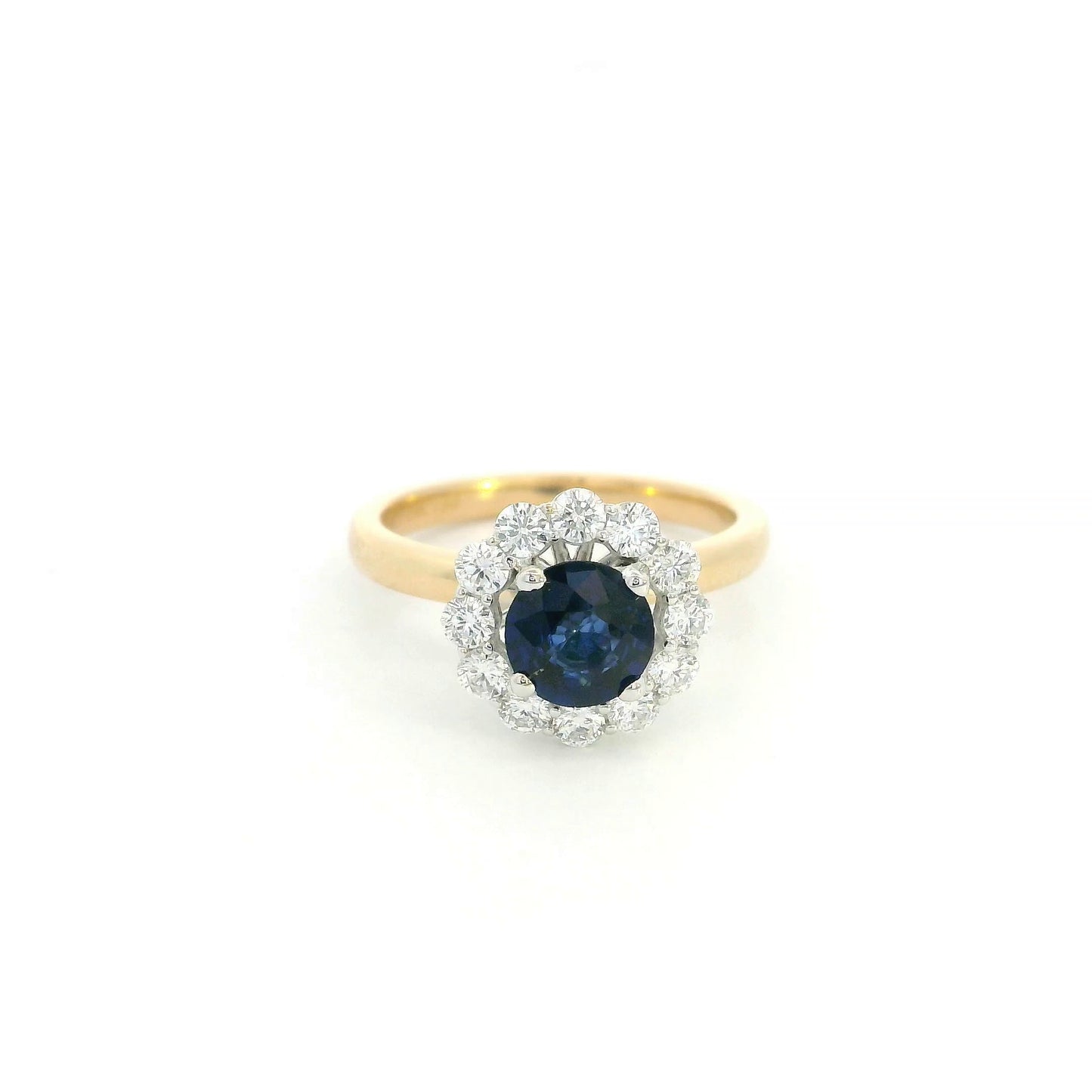 Round blue sapphire and diamond ring in 18K yellow gold with 0.84 carat natural sapphire and diamond surround