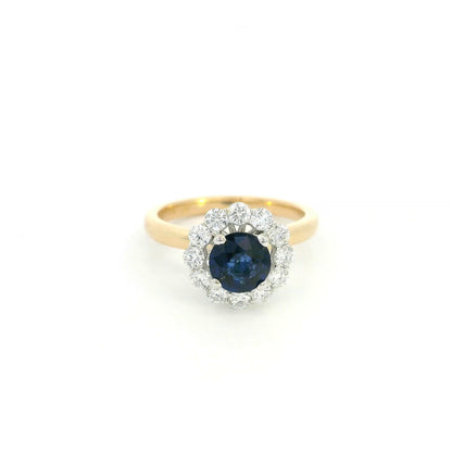 Round blue sapphire and diamond ring in 18K yellow gold with 0.84 carat natural sapphire and diamond surround