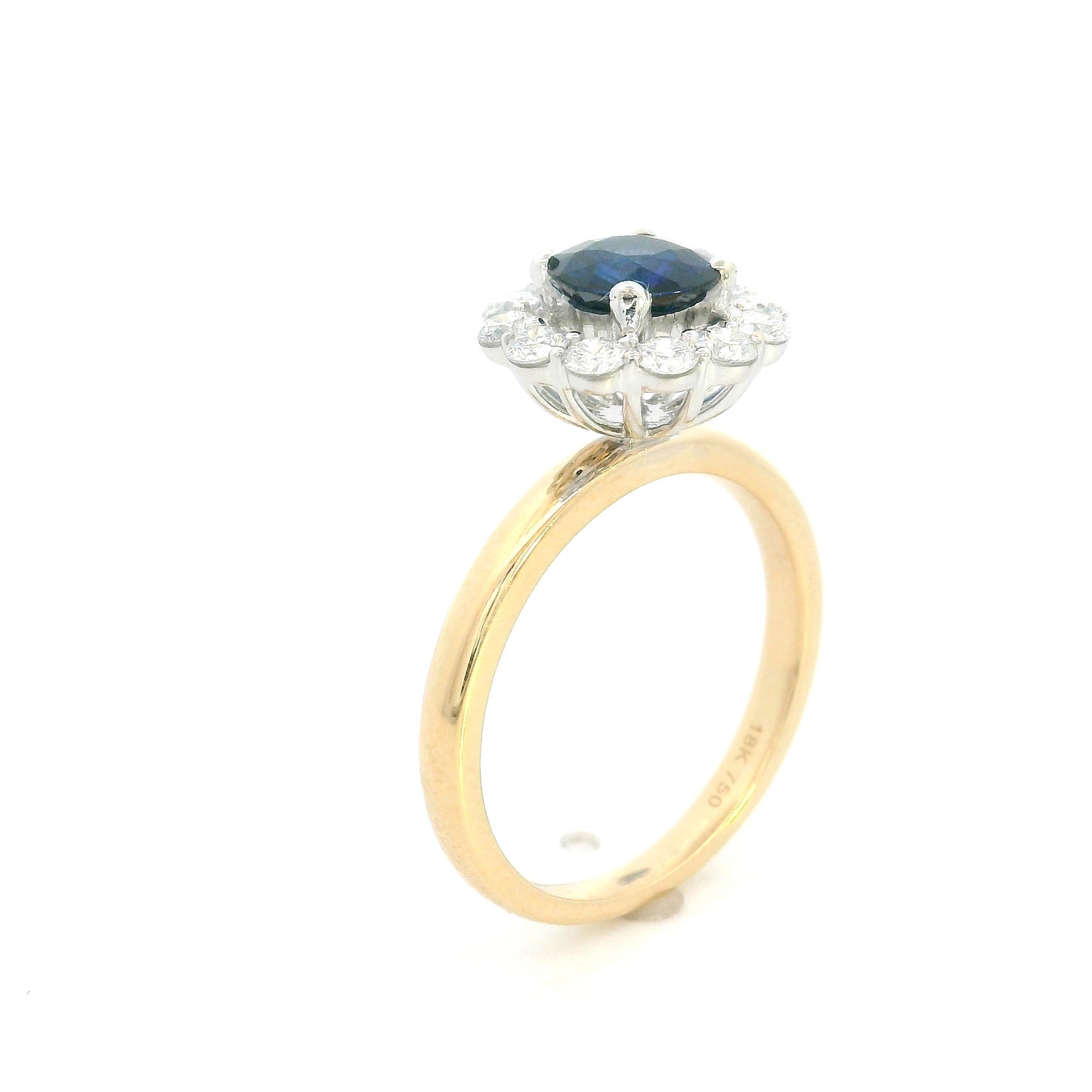 Round blue sapphire and diamond ring in 18K yellow gold with 0.84 carat natural sapphire and diamond surround