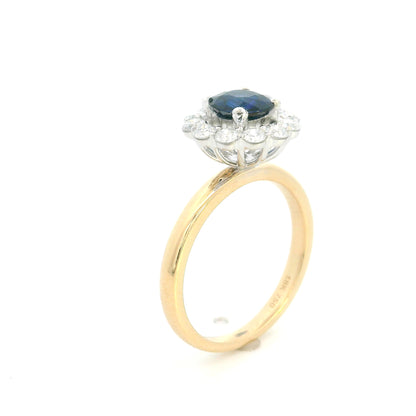Round blue sapphire and diamond ring in 18K yellow gold with 0.84 carat natural sapphire and diamond surround