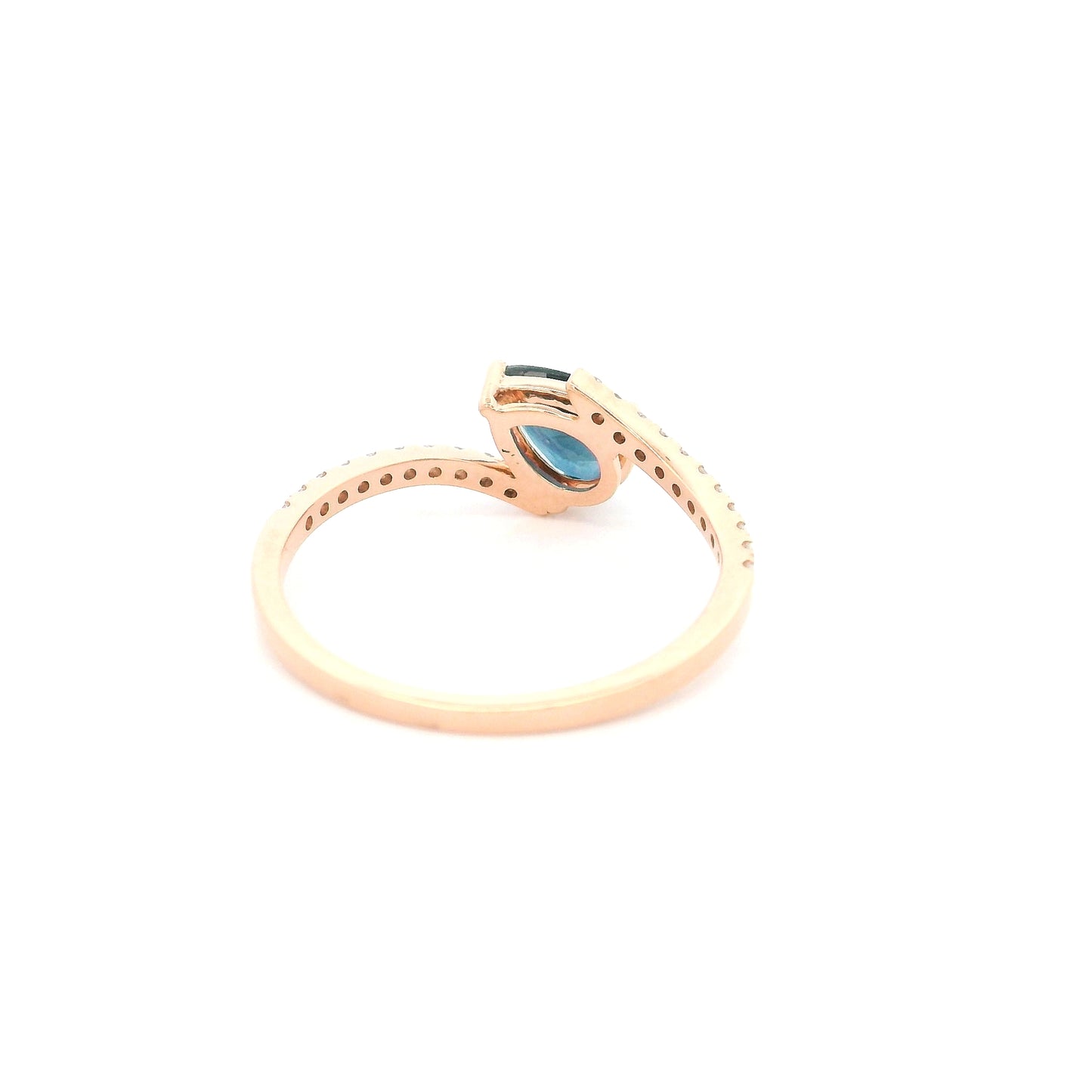 Natural pear-shaped blue sapphire ring in 18K rose gold featuring a 0.78 carat blue sapphire with a bypass diamond band set with 0.19 carat natural diamonds.