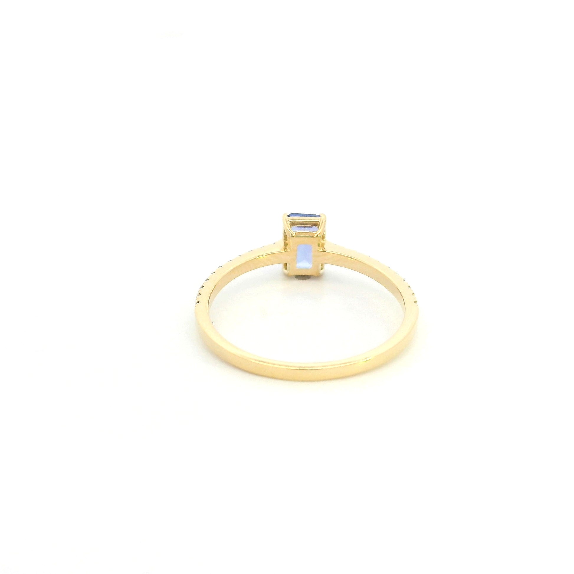 18K Yellow Gold Emerald Cut Tanzanite Ring featuring a 0.49 carat natural emerald cut tanzanite with 0.14 carat natural diamond shoulders in a classic solitaire design.