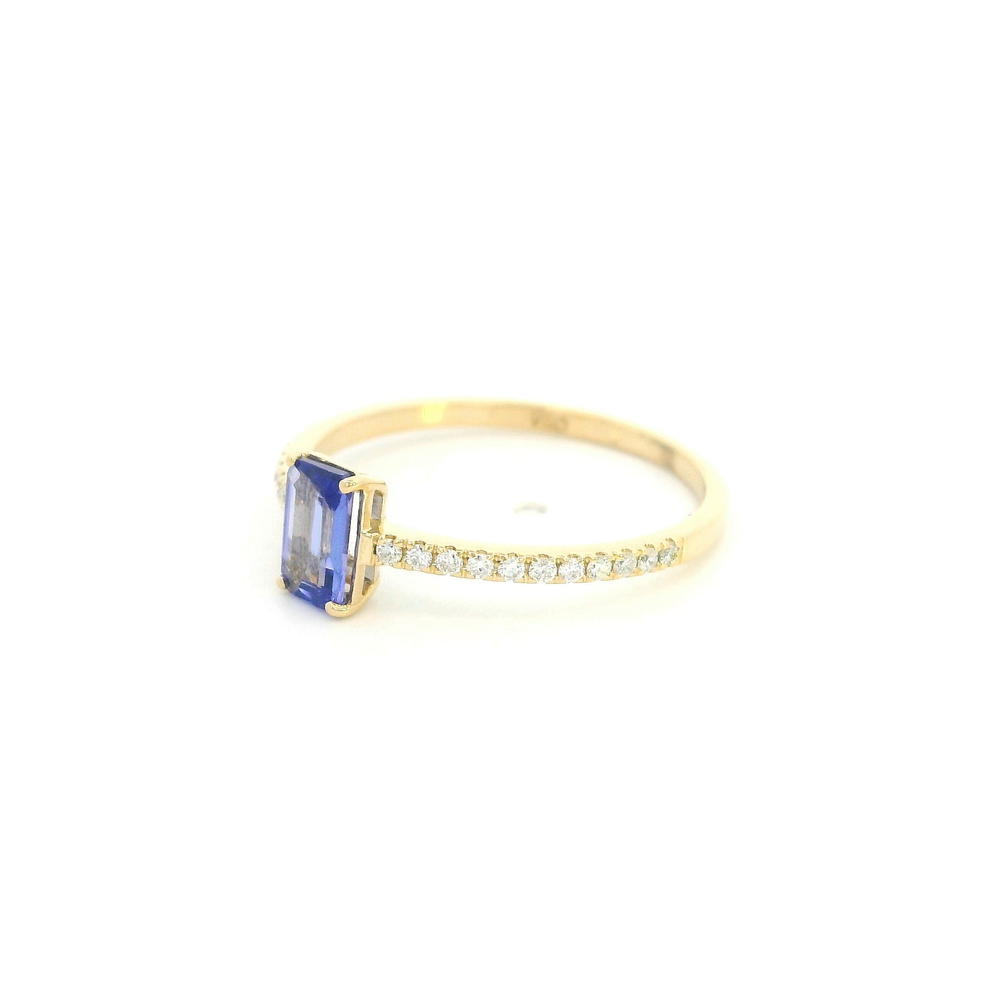 18K Yellow Gold Emerald Cut Tanzanite Ring featuring a 0.49 carat natural emerald cut tanzanite with 0.14 carat natural diamond shoulders in a classic solitaire design.