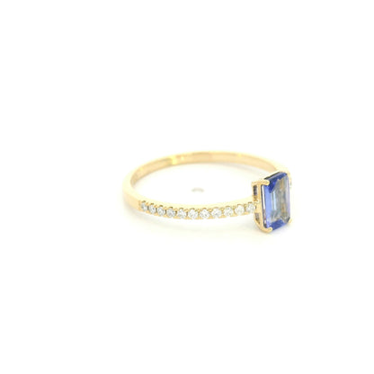 18K Yellow Gold Emerald Cut Tanzanite Ring featuring a 0.49 carat natural emerald cut tanzanite with 0.14 carat natural diamond shoulders in a classic solitaire design.