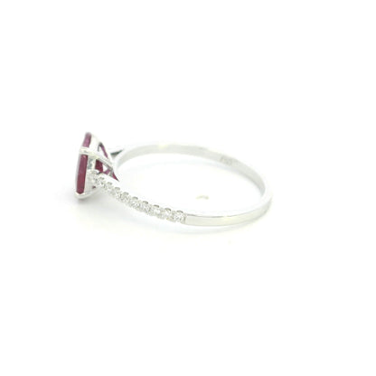 Ruby diamond ring in 18K white gold featuring a natural 1.32 carat oval-cut ruby with a diamond-set band.